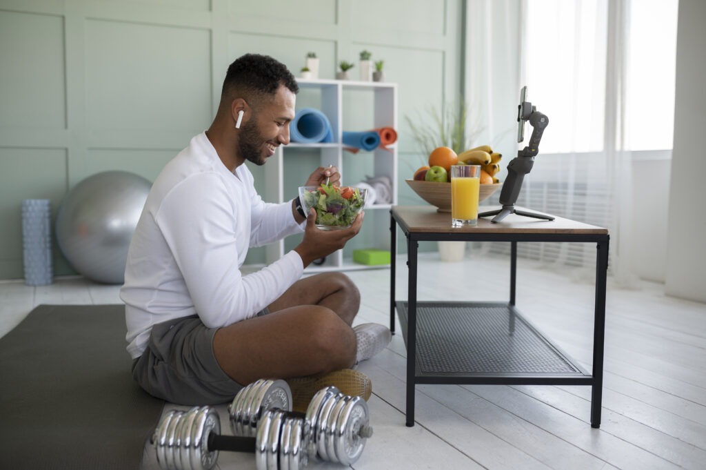Man eating a fresh salad following a nutrient-dense GLP-1 lifestyle protocol.