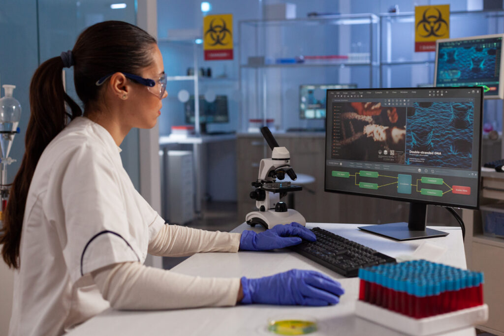 Preclinical investigator evaluating peptide reconstitution research data on a laboratory screen.