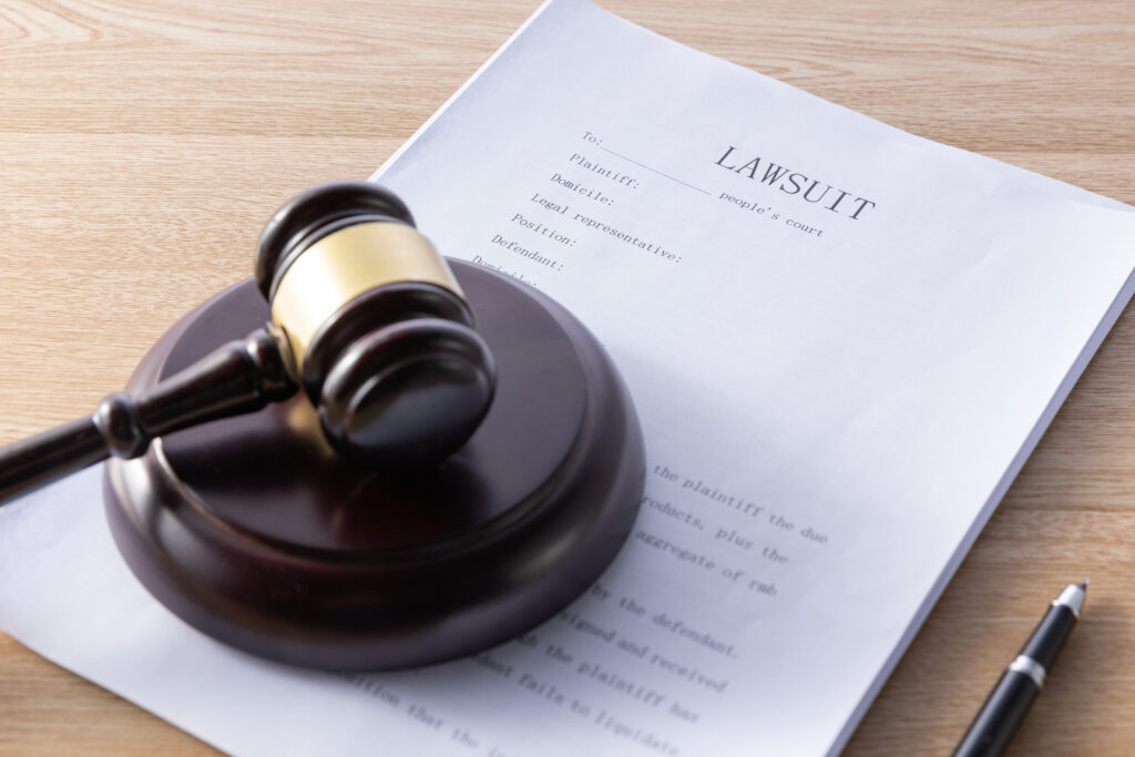 Legal case filings and documents on a desk, representing the procedural history of the classification dispute from the 2024 FDA determination through the pending appeal.